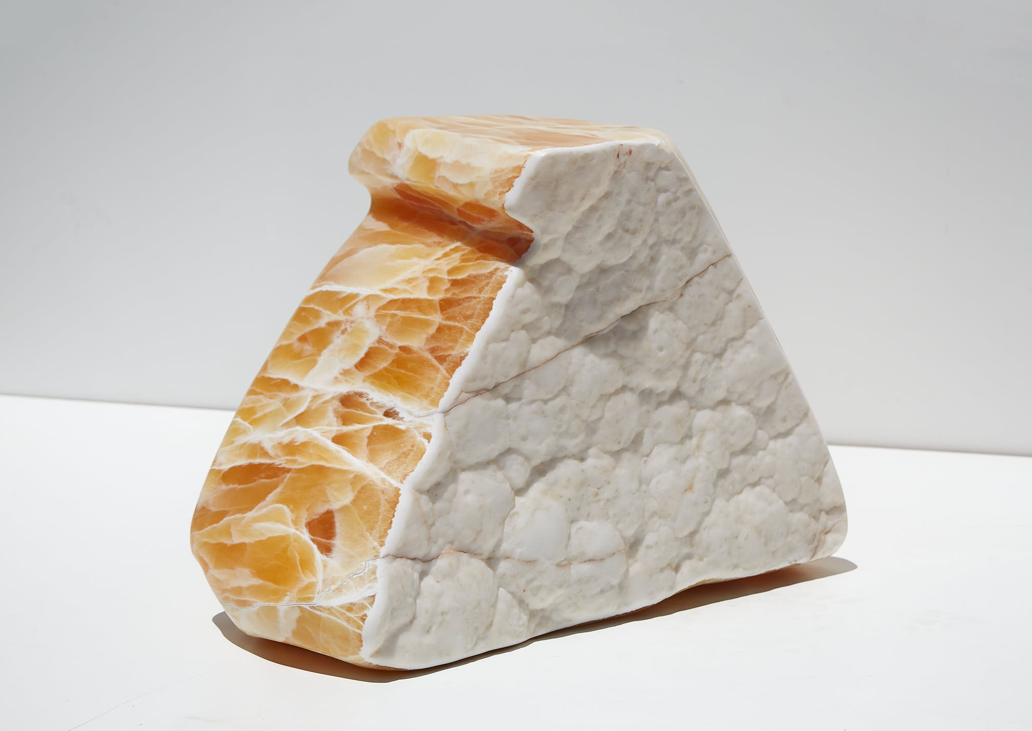 Refigured orange calcite sculpture by ian collings